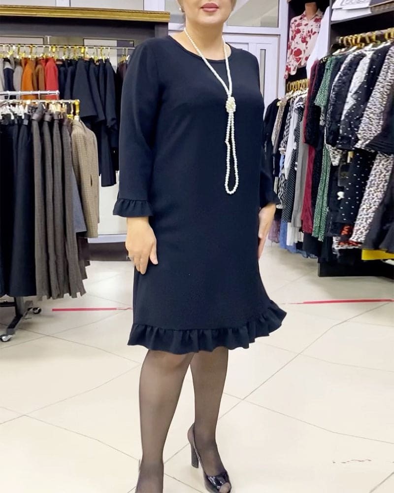 Laura - Een geplooide patchwork jurk in één effen kleur