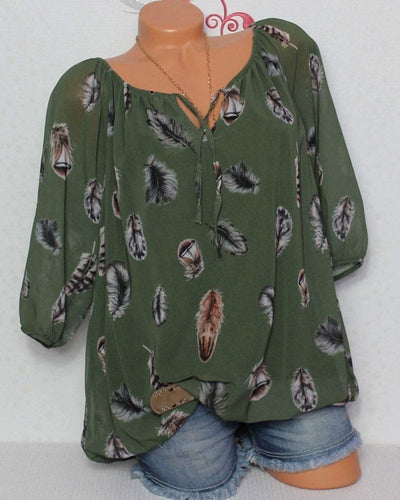 Maud | Losvallende blouse met verenprint