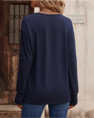 Jara - Een blouse met lange mouwen en een V-hals