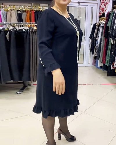 Laura - Een geplooide patchwork jurk in één effen kleur