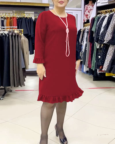 Laura - Een geplooide patchwork jurk in één effen kleur