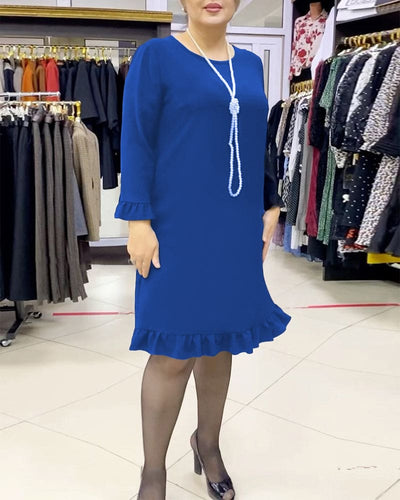 Laura - Een geplooide patchwork jurk in één effen kleur