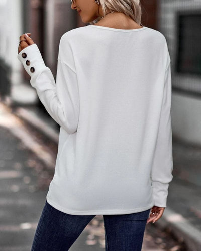 Jara - Een blouse met lange mouwen en een V-hals