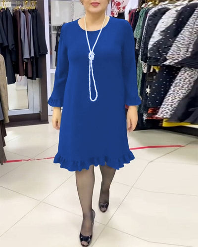 Laura - Een geplooide patchwork jurk in één effen kleur
