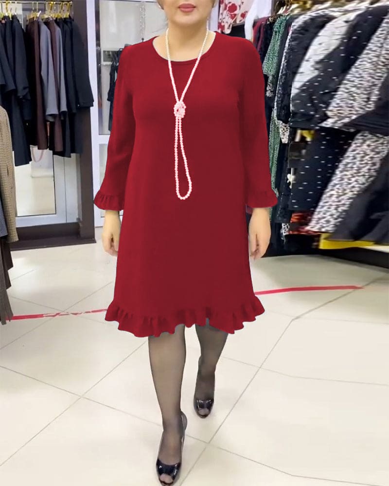 Laura - Een geplooide patchwork jurk in één effen kleur