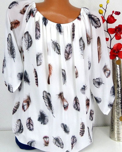 Maud | Losvallende blouse met verenprint