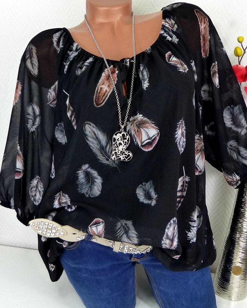 Maud | Losvallende blouse met verenprint