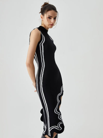 Tessel | Gebreide midi-jurk met asymmetrische contrasterende bies