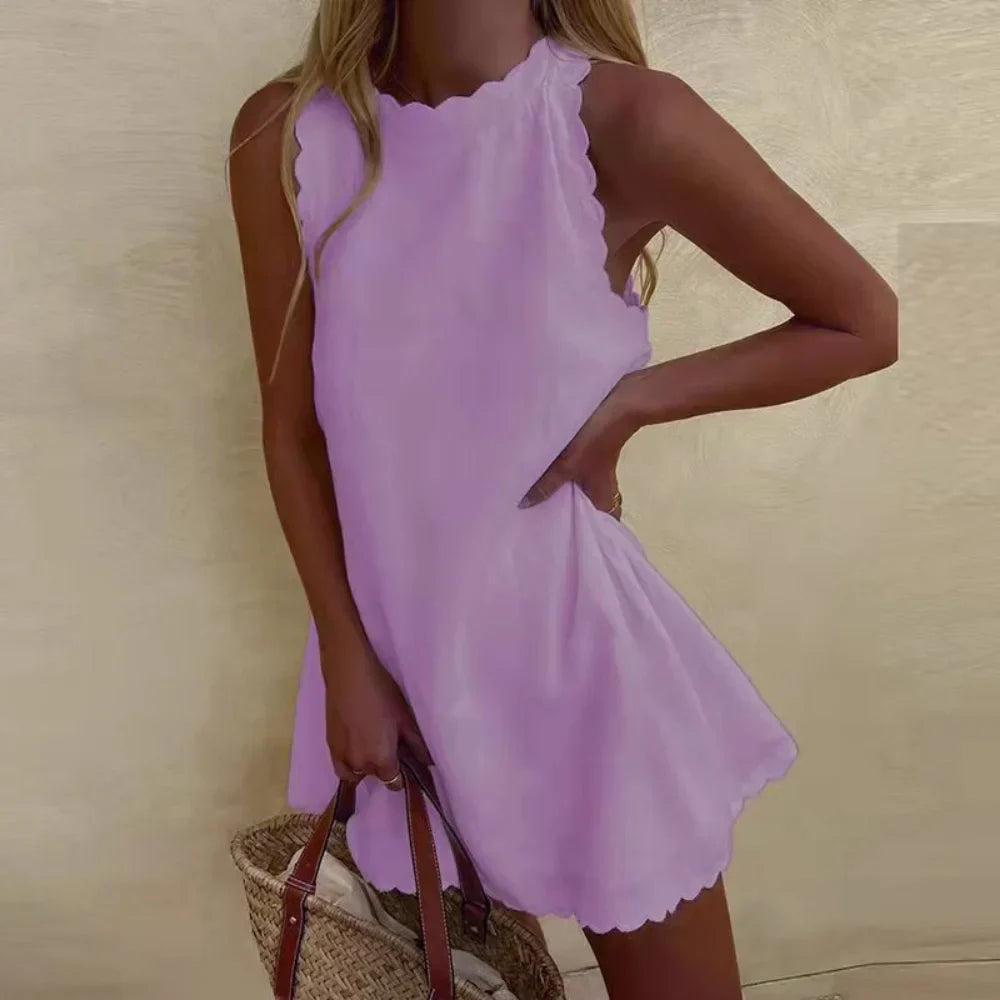 Alyssa - Chic mouwloos geschulpte mini jurk