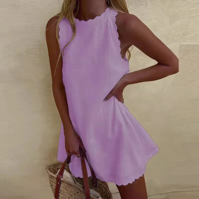 Alyssa - Chic mouwloos geschulpte mini jurk