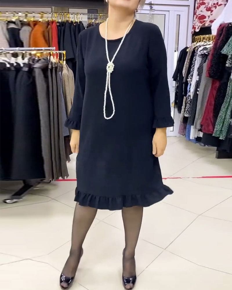 Laura - Een geplooide patchwork jurk in één effen kleur