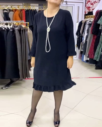Laura - Een geplooide patchwork jurk in één effen kleur