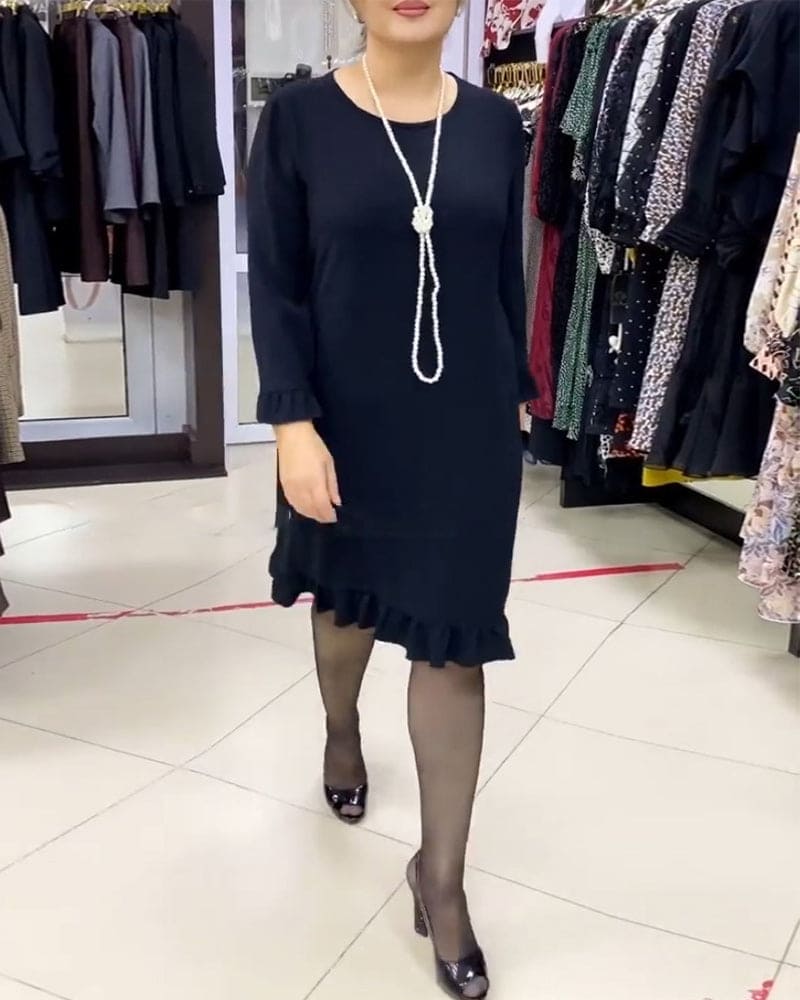 Laura - Een geplooide patchwork jurk in één effen kleur