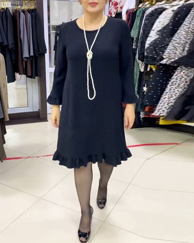 Laura - Een geplooide patchwork jurk in één effen kleur