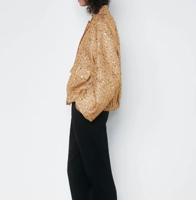 Isabella - Elegante oversized jas met goudkleurige pailetten